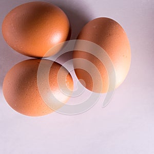 Close-up of fresh brown eggs ,top view,copy space,background