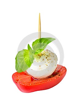 Close-up of fresh caprese skewer with mozarella and tomato isolated on withe background. Healhy mediterranean cuisine and