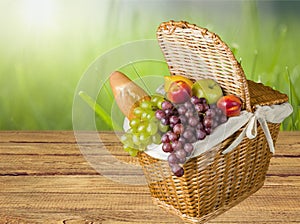 Close-up of fresh food in brown basket on nature