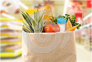 Close-up of fresh food in shopping bag on