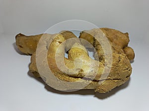 Fresh Ginger Root on White Surface