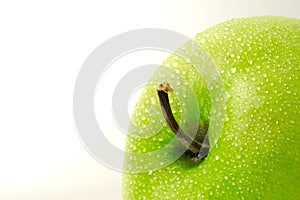 Close up fresh green Apple granny smith isolated on white background with water droplet â€“ macro shoot