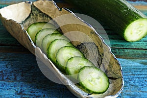 Close up of fresh juicy cucumber cut in slices.