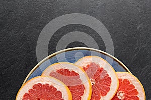 Close up of fresh juicy grapefruits on plate