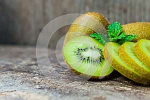 Close up fresh kiwi fruit on old wood background.