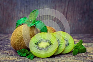 Close up fresh kiwi fruit on old wood background.