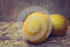 Close up fresh kiwi fruit on old wood background.