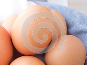 Close up fresh organic eggs on basket.  High protein and Vitamin foods.