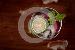 Close-Up of  fresh organic fruit jamun Syzygium Cumini  lemonade with lime and chilled water and ice  jamun seeds are kind of