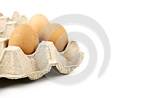 Close up Fresh organic natural brown Chicken eggs in paper tray isolated on white background.Healthy and Natural Food concept