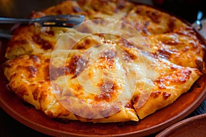 Close up of fresh Ossetian pie with double cheese