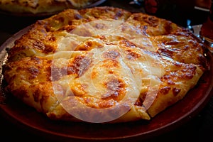 Close up of fresh Ossetian pie with double cheese