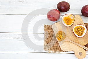 Close up a fresh passion fruit on white wooden table background