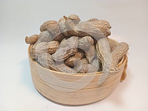 close up of fresh peanuts on white background