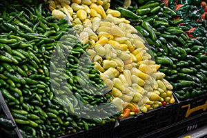 Close-up of fresh peppers on the store counter. Eco products, organic products on the market.