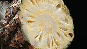 Close up of fresh pineapple with slice of peel pineapple insert. Comestible. photo