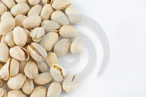 Close up of fresh pistachios on white