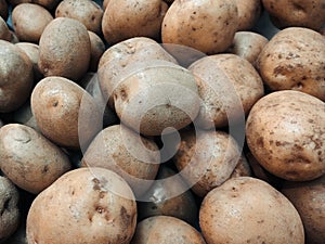 Close up of fresh raw potatoes in a market