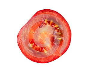 Close-up of a fresh red tomato slice showing seeds and juicy texture photo