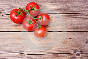 Close-up of fresh, ripe cherry tomatoes on wood