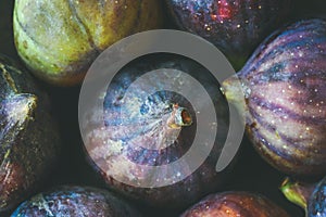 Close-up of fresh ripe seasonal purple figs, top view