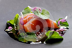 Close up of fresh salmon sashimi with fresh spices