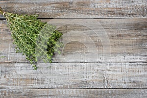 Close-up fresh Savory aromatic herb on rustic wooden table