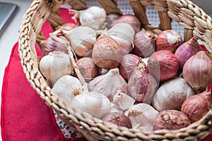 Close-up fresh shallots and garlics in the basket