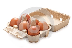 Close-up  of fresh six chicken eggs in a tray on a white background.Isolated with clipping path photo