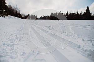 Close-up of fresh snow at cross country skiing track.