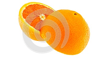 Close up of fresh sunkist orange cut half isolated photo
