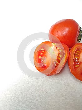 Close up of fresh tomatoes  white background