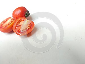 Close up of fresh tomatoes  white background