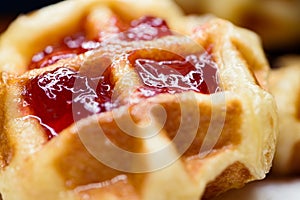 Close up fresh waffles with above strawberry jam