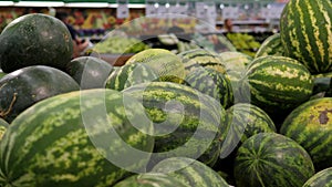 Close-up of fresh watermelons in a box in the supermarket.