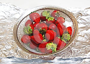 Close up of fresh wet strawberries - healthy diet concept