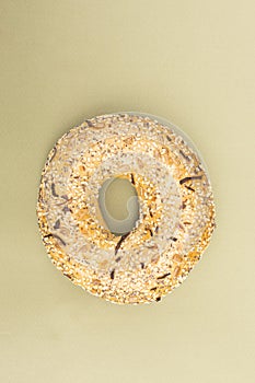 Close-up of a freshly baked bagel sprinkled with sesame seeds