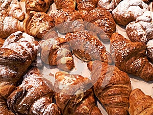 close-up of freshly baked buns and croissants on a store counter photo
