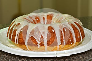 A close up of a freshly baked lemon cake with icing