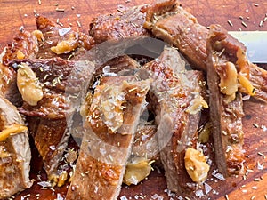 Close up of freshly cooked pork Secreto de ventresca pure iberico with garlic photo