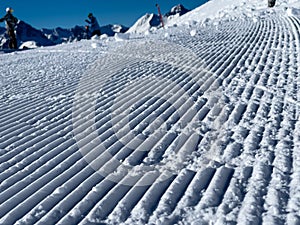 A close up of freshly groomed snow slope