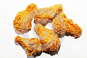 Close-up of fried delicious, appetizing five chicken wings made from fresh meat in a spicy sauce and breaded a popular dish in res