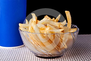 Close up Fried French Fries in glass bowl and black background