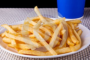 Close up Fried French Fries in white plate and soft drink