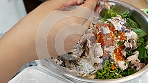 Close up of fried mackerel served with fresh vegetable with shrimp-paste sauce, Mieng Plaa Too, being prepared