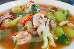 Close up.Fried noodle with seafood pork and kaletra in Gravy sauce.