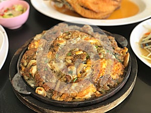 close up Fried Oyster in Hot Frying Pan, food cusine concept