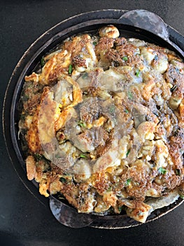 close up Fried Oyster in Hot Frying Pan, food cusine concept