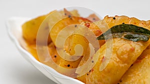 Close-up Fried Potato Curry in leaf shape ceramic bowl,