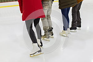 Close up of friends on skating rink